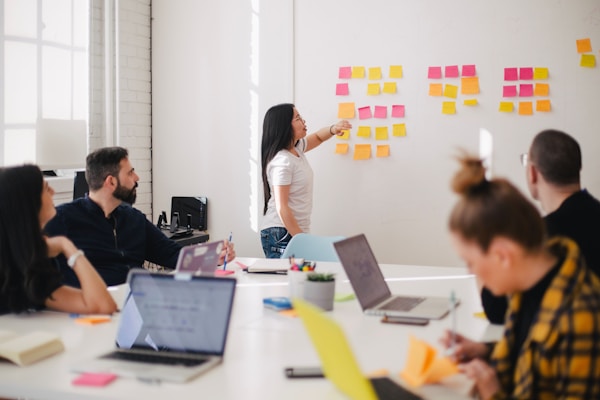 Colleagues in a strategy meeting discussing plans